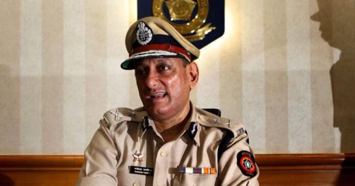 Rakesh Maria in police uniform - Highlighting his role in the investigation of the 1993 Mumbai bomb blasts and the involvement of actor Sanjay Dutt.