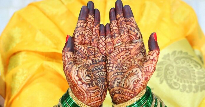 Mehndi application on hands