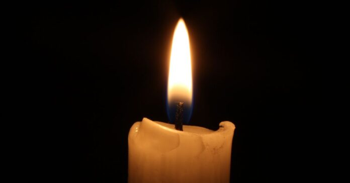 A flame rising from a candle wick