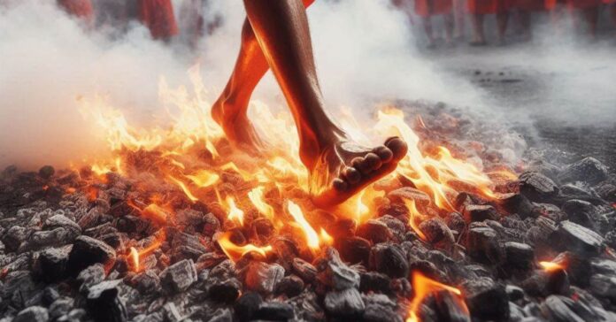 A person walking on burning coals during a traditional festival