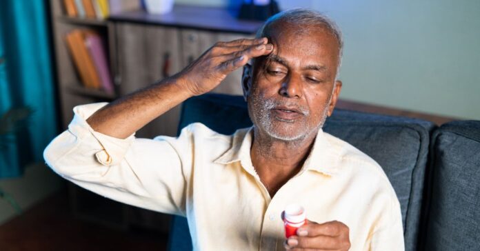 Balm being applied to forehead for headache relief.