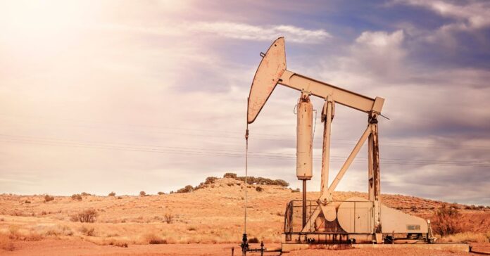 A desert landscape with oil rigs extracting oil in deserts.